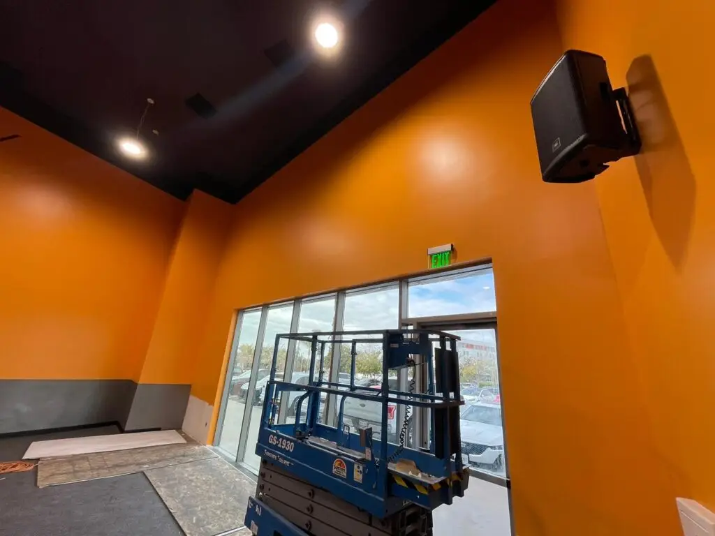 orange wall with speaker
